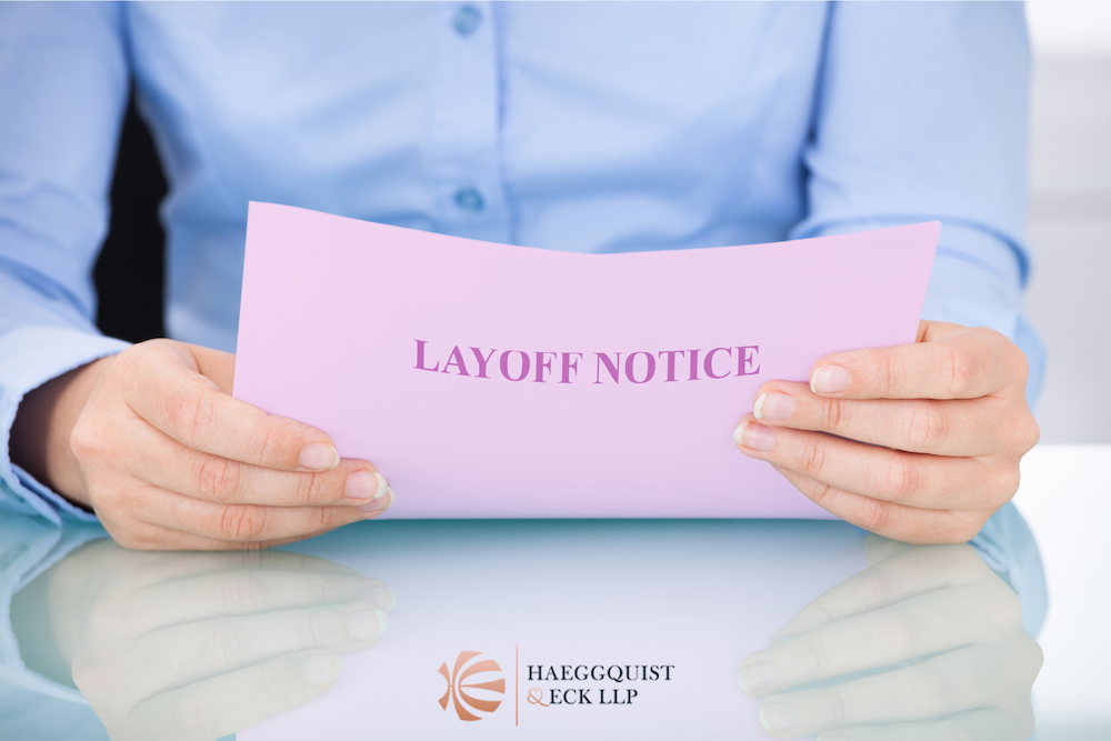 woman holding Layoff notice