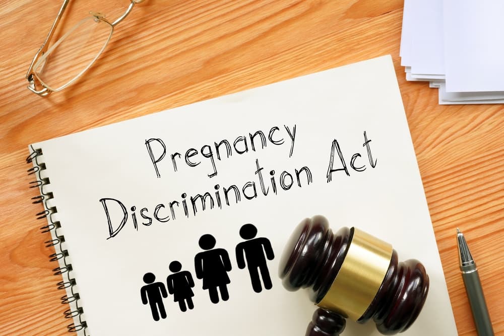 A photograph displays the text related to the Pregnancy Discrimination Act.