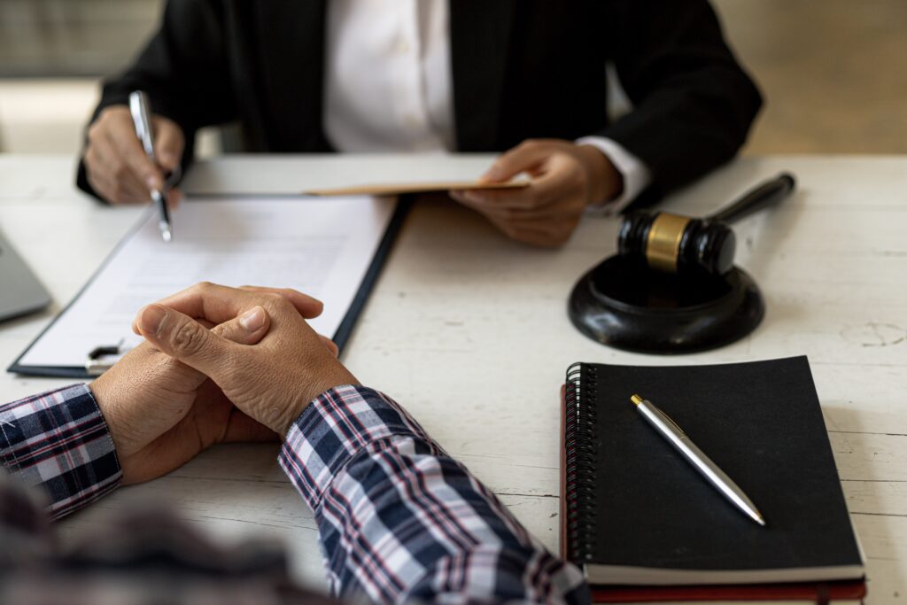 Discrimination lawyer discussing case with client