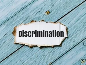 Phrase about racial discrimination displayed on a striped cupboard