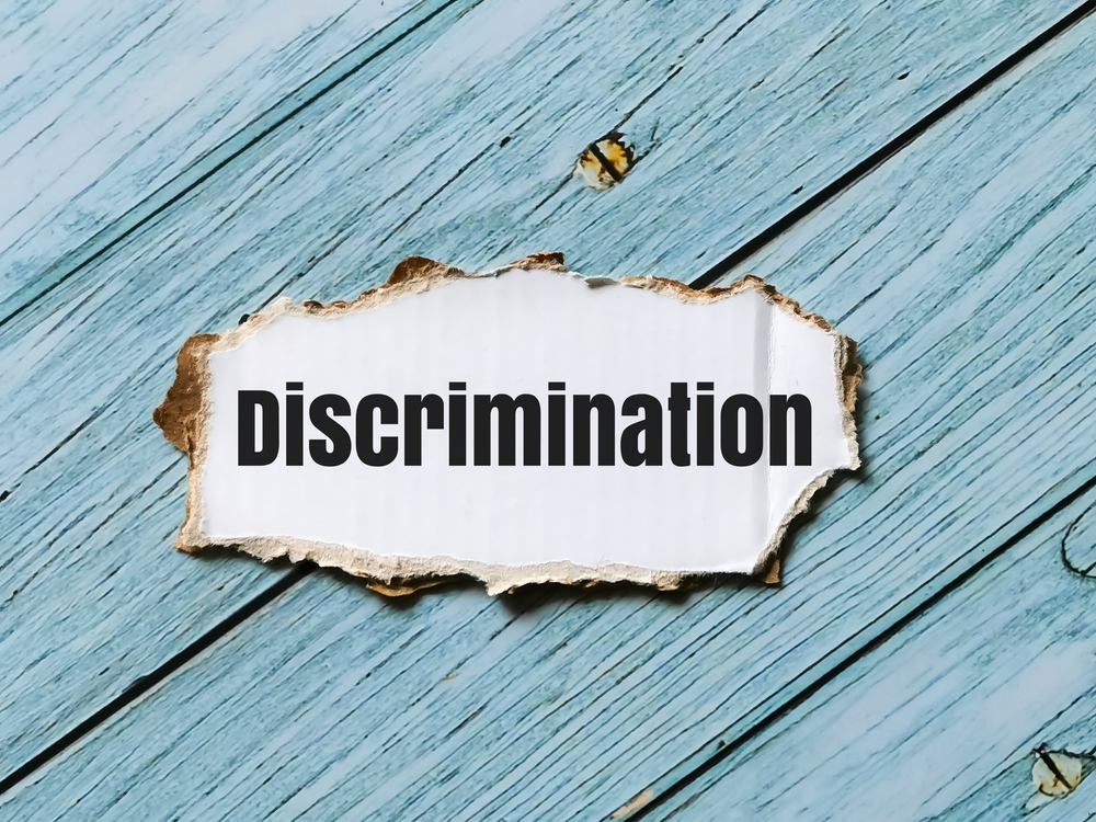 Phrase about racial discrimination displayed on a striped cupboard