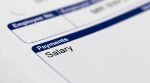 Close up of paycheck showing salary highlighting unpaid wages or short paycheck issue in San Diego