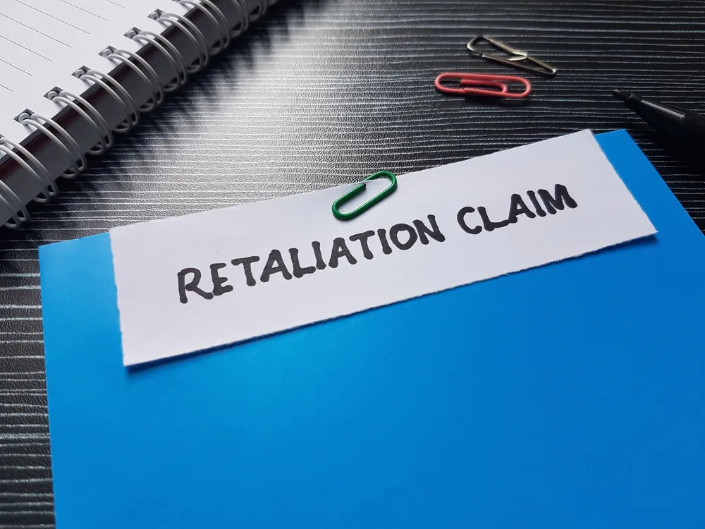 Retaliation claim writting on table background.